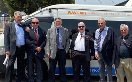 Group of passengers with maxi taxi Melbourne vehicle highlighting corporate and group transport booking service